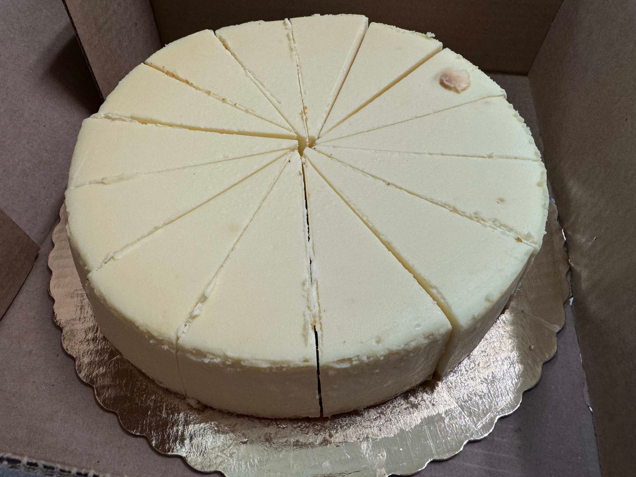 Slice New York Cheesecake.