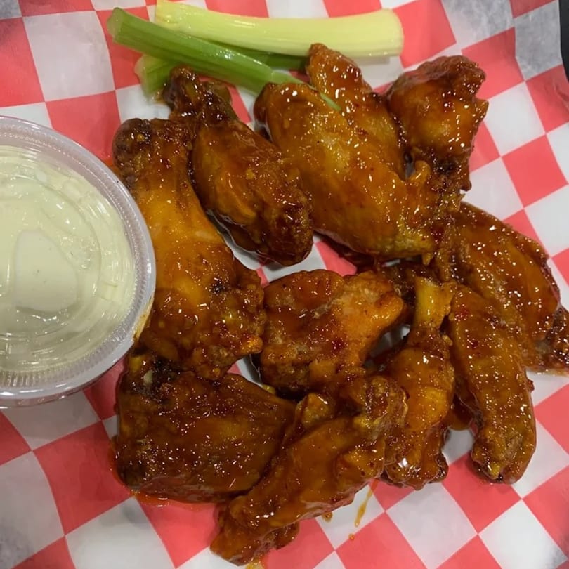 Beto’s Restaurant and Pizza’s honey-glazed chicken wings with a side of ranch and celery sticks.